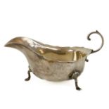A George V silver gravy boat by Barker Brothers.