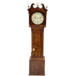 An oak eight-day longcase clock.