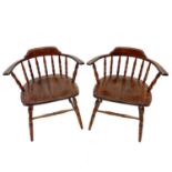 A pair of beech and ash smokers bow style elbow chairs.