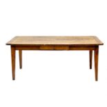 A French farmhouse poplar and fruitwood dining table.