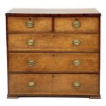 A late George III oak chest.