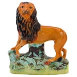 A Victorian Staffordshire figure of a lion.