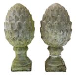 A pair of concrete cone finials.