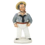 A Victorian Staffordshire figure of a sailor.