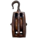 A large 19th century teak and iron bound ships block and tackle.