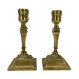 A pair of Georgian brass candlesticks.