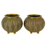 A pair of Indian gilt bronze cache pots, 19th century.