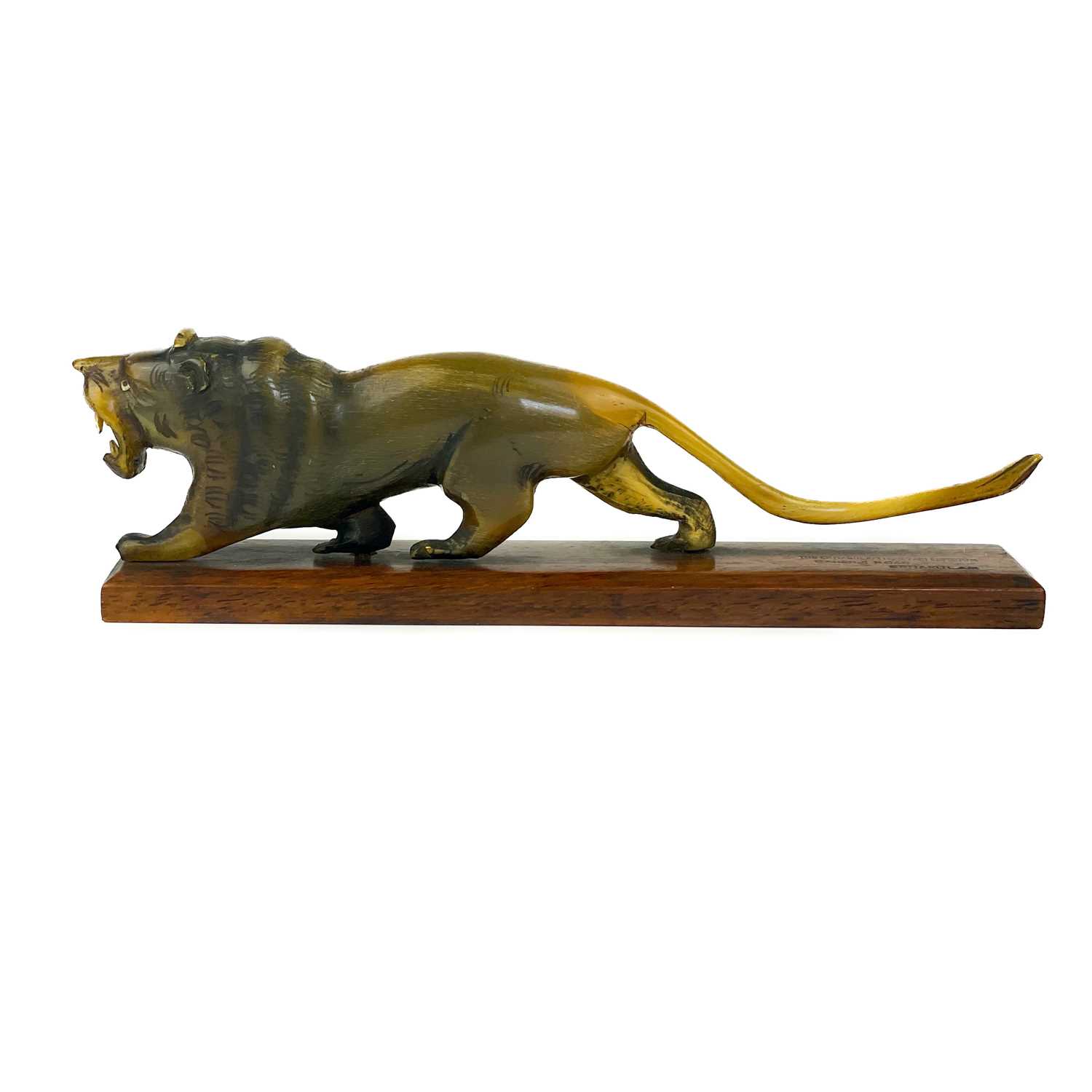 A Chinese carved horn model of a lion, early 20th century.