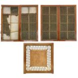 Two pairs of cupboard doors with ornate gilt brass grilles