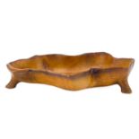 A fruit wood carved bowl.