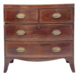 A 19th century bow fronted chest of drawers.