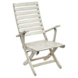 A white painted folding steamer type chair.
