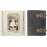 CRICKET INTEREST: A Victorian brass clasped photograph album.