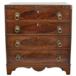 A George III mahogany and inlaid chest of four graduated long drawers.