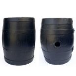 Two black painted barrels.