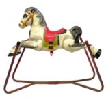 A Mobo child's tin rocking horse.
