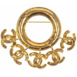 A Chanel CC logo charm gold tone brooch.