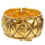 A Chanel 1980's gold-tone quilted design hinged bangle.