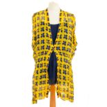 A Chanel yellow and black silk dress and navy blue blouse.