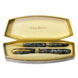 A Conway Stewart no.27 fountain pen and no.37 propelling pencil cased set.