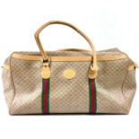 A Gucci holdall weekender bag.