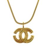 A Chanel gold-tone CC pendant.