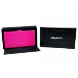A Chanel Fuchsia caviar leather wallet.