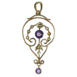 An Art Nouveau 9ct rose gold amethyst and seed pearl open work pendant.