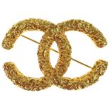 A Chanel CC 'lava' gold-tone brooch.