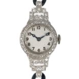 An Art Deco platinum and diamond cased lady's manual wind wristwatch.
