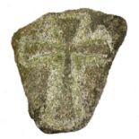 A granite low relief carved cross.