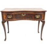 A walnut side table, in the early 18th century style.