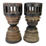 A pair of unusual large candle holders.