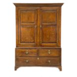 A George III oak livery cupboard or wardrobe.