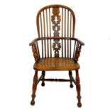 A yew and ash Windsor armchair.
