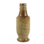 A small brown saltglaze flask or bottle.