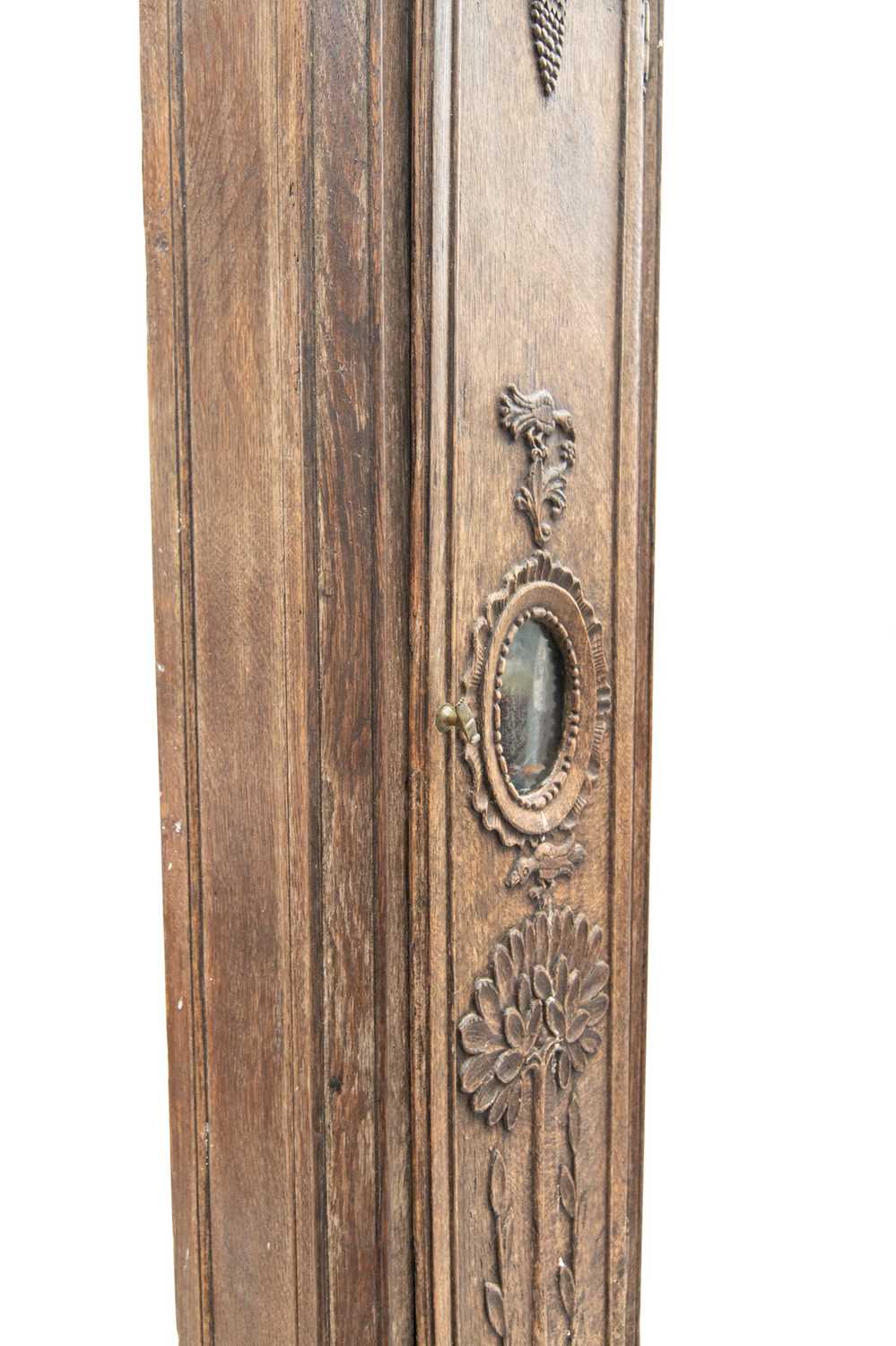 A late 19th century French provincial oak carved longcase clock. - Image 5 of 7