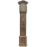 A late 19th century French provincial oak carved longcase clock.