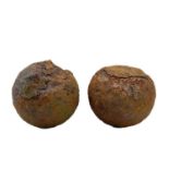 Two cast iron cannonballs,