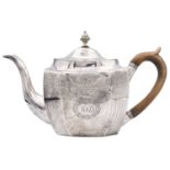 A George III silver teapot by Thomas Wallis II.