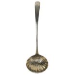 A silver ladle by William Ward.