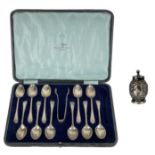 A George V silver teaspoon set for eleven (one spoon missing) within fitted box by Walker & Hall.