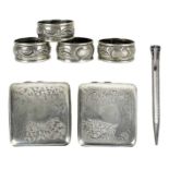 Two silver cigarette cases, a propelling pencil and four napkin rings.