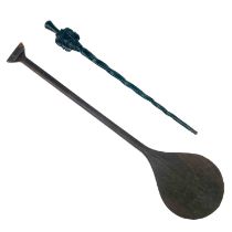 An African hardwood paddle.