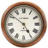 A late Victorian circular mahogany eight-day wall clock.