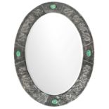 An Arts and Crafts oval pewter mirror.