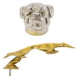 A chrome plated bottle opener modeled as the head of a Mastiff type dog.