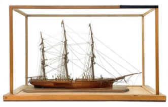 A 19th century scratch built model of the Schooner Carnest.