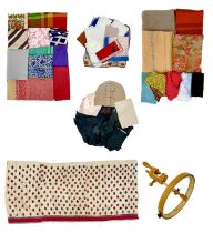 A large collection of various scarves and handkerchiefs.