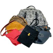 A collection of various handbags.